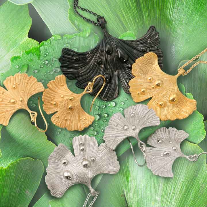 Ginkgo Leaf After Rain Pendant-Necklace and earrings plated in 14k gold, rhodium and black jet rhodium on green ginkgo leaves with water droplets
