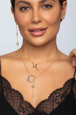 beautiful model with dark hair wearing black top showcasing the ARY D'PO Shiny Stars Jewelry Collection