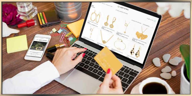 Shopping Online: Best Practices woman holding credit card and shopping jewelry on laptop at ary dpo websit