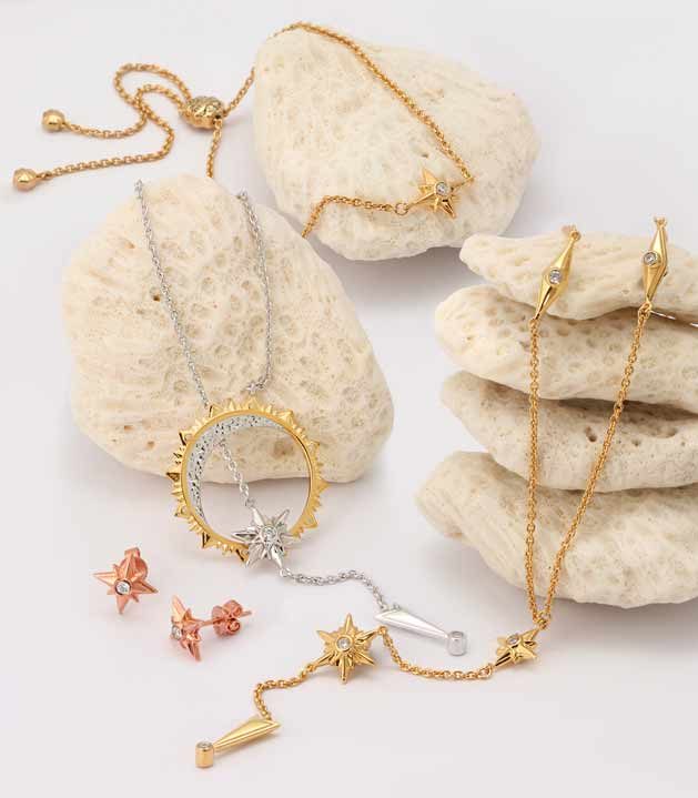 Shiny Stars jewelry collection in gold and rhodium over sterling silver by ARY DPO on white rocks