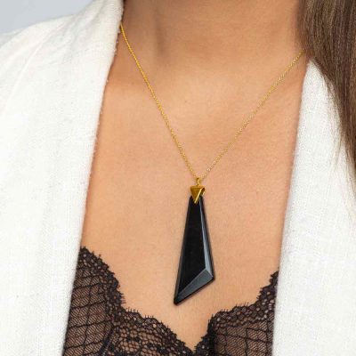 Obsidian S03 Sterling Silver 18K Gold Plated Necklace BLACK shown on the model wearing black top and white jacket