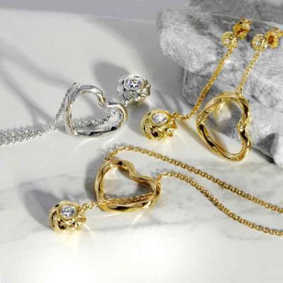 ARY DPO Hearts and Orbs Jewelry Collection on white marbles