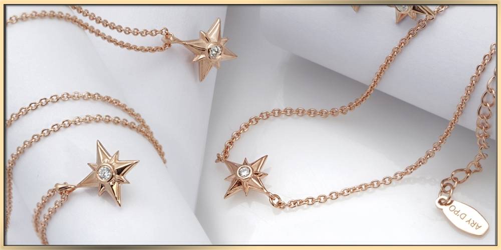 ARY D'PO shiny stars necklaces in rose gold on a white background