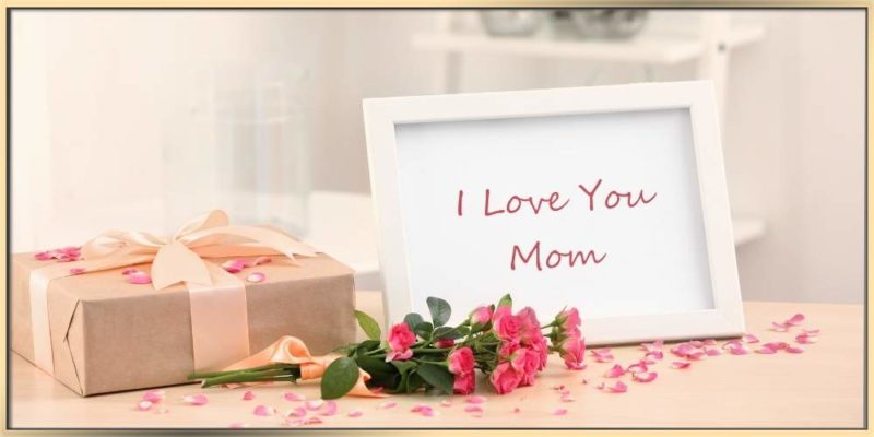 Mother's Day Gift and flowers with I Love You Mom picture in a white frame