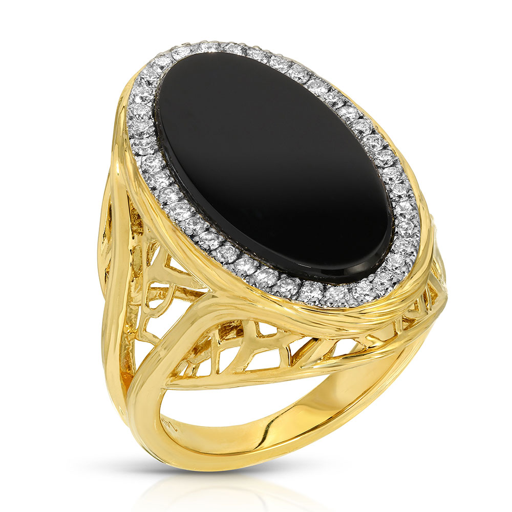 A ring in yellow gold with flack agate oval stone on top surrounded with diamond stones. The gold ring has a V-shaped pattern twisted band which branches like a tree of life with a double V for Victory and straight