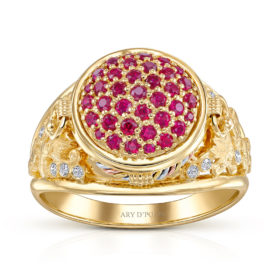 The Karas Tribute Ring designed by ARY D'PO: A luxurious piece of wearable art, this 18K Yellow Gold cocktail ring is meticulously crafted in the shape of a traditional Armenian Karas (wine jar). The design tells a story: vibrant, deep-red rubies symbolize the rich wine held within, while sparkling, pave-set diamonds represent pure water droplets, essential for the vine. The setting is completed with hand-sculpted gold grape leaves adorning the sides, celebrating the ancient art of winemaking. This unique ring is a true conversation starter and an heirloom piece.