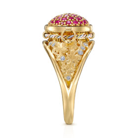 The Karas Tribute Ring designed by ARY D'PO: A luxurious piece of wearable art, this 18K Yellow Gold cocktail ring is meticulously crafted in the shape of a traditional Armenian Karas (wine jar). The design tells a story: vibrant, deep-red rubies symbolize the rich wine held within, while sparkling, pave-set diamonds represent pure water droplets, essential for the vine. The setting is completed with hand-sculpted gold grape leaves adorning the sides, celebrating the ancient art of winemaking. This unique ring is a true conversation starter and an heirloom piece.